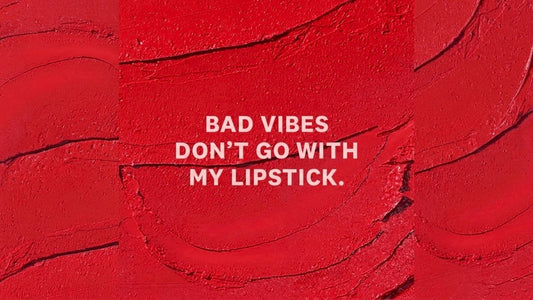 Woman journaling wellness goals on living room couch